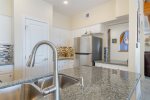 Gorgeous stainless steel new appliances and granite countertops in the kitchen